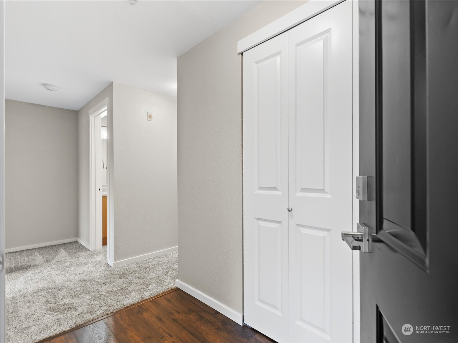 12404 East Gibson Road, Unit J303 Everett, WA 98204 - Photo 23 of 40 a view of a hallway with wooden floor