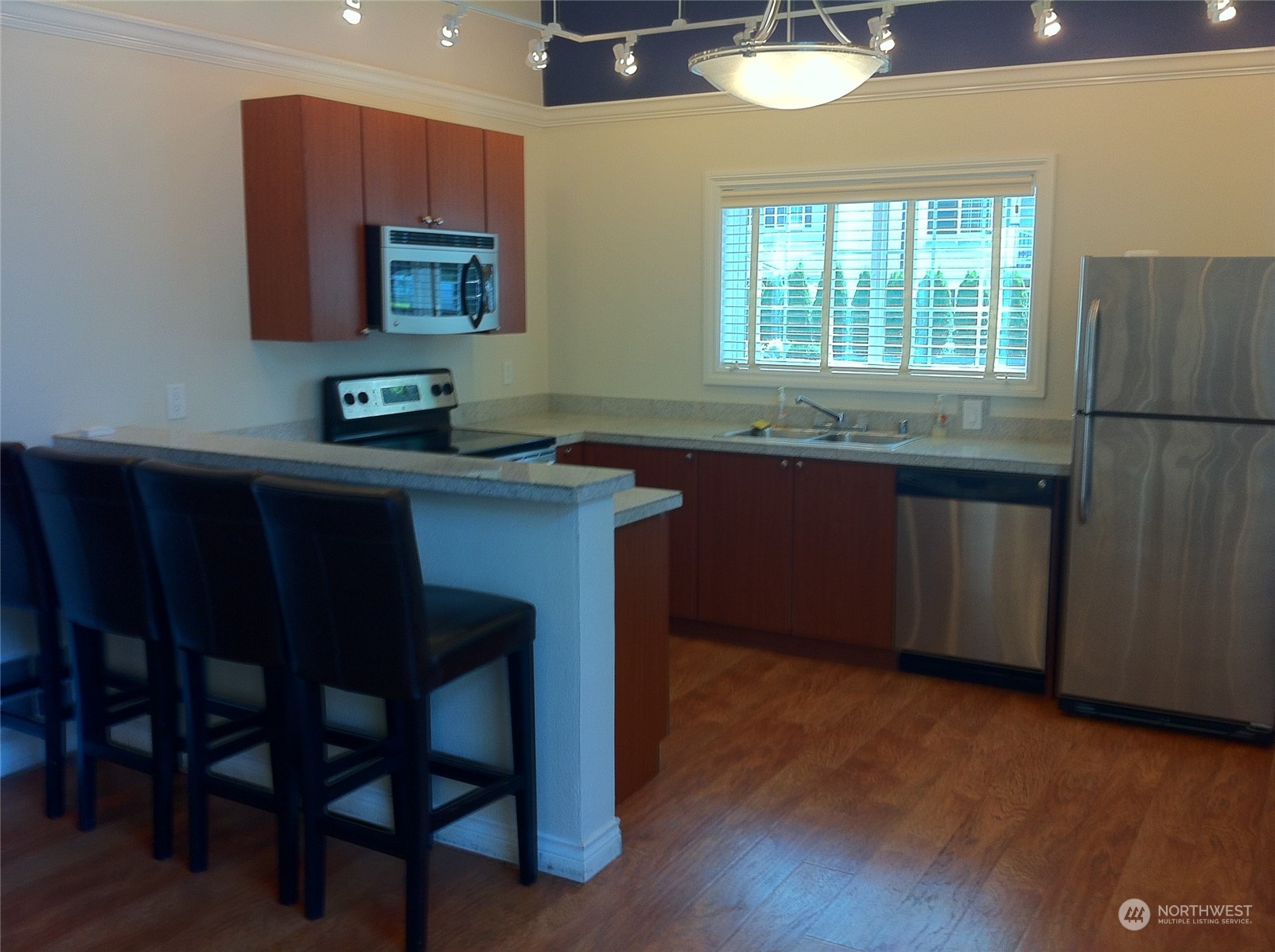 12404 East Gibson Road, Unit J303 Everett, WA 98204 - Photo 32 of 40 a kitchen with a sink cabinets and window