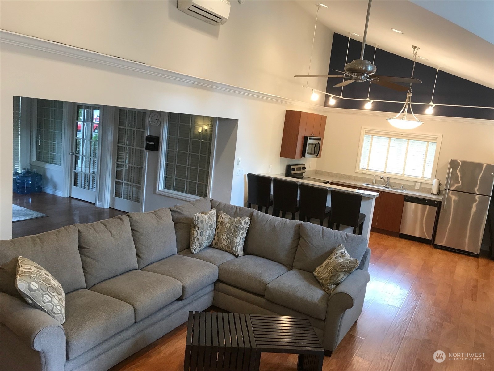 12404 East Gibson Road, Unit J303 Everett, WA 98204 - Photo 33 of 40 a living room with furniture and wooden floor