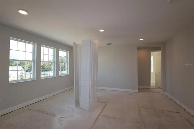 a bathroom with a shower sink and mirror