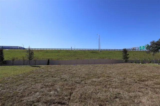 a view of a field with an ocean