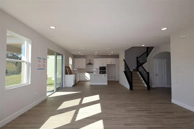 a view of a living room and a wooden floor