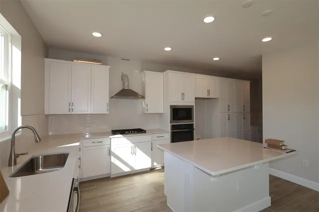 a bathroom with a sink and a window