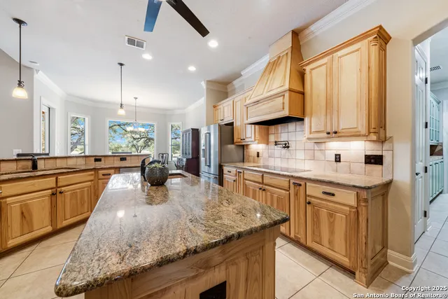 a spacious bathroom with a double vanity sink mirror and bathtub