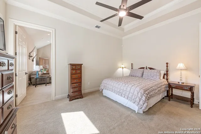 a green field with lots of trees