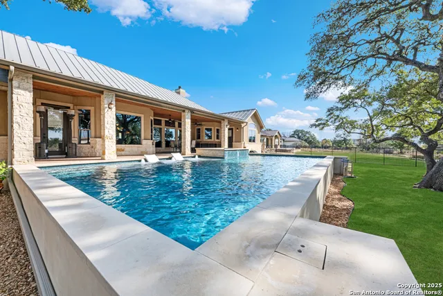 an aerial view of a house with outdoor space
