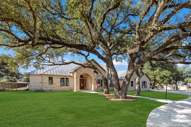 a living room with furniture and a mirror