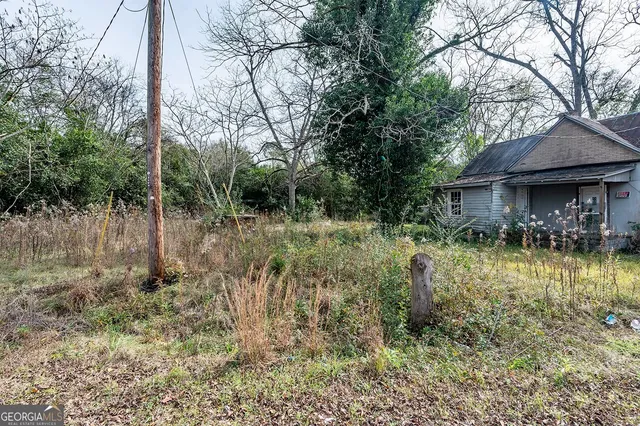 a backyard of a house with lots of green space