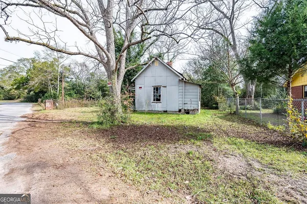 a house with trees in front of it