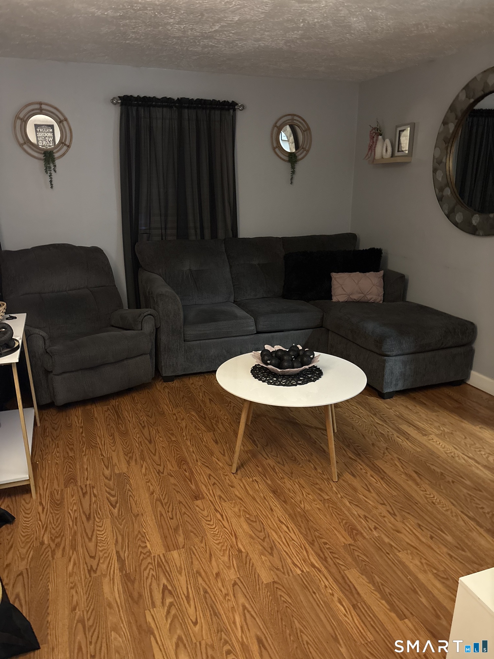 55 New Hanover Avenue Meriden, CT 06451 - Photo 14 of 33 a living room with furniture and a wooden floor