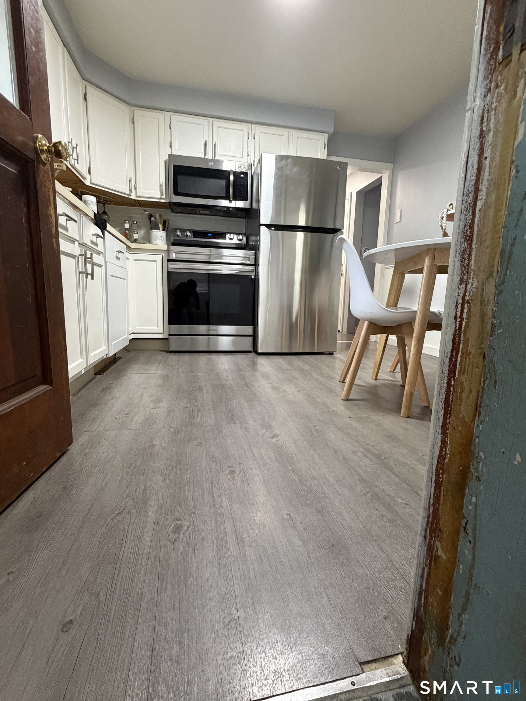 55 New Hanover Avenue Meriden, CT 06451 - Photo 28 of 33 a kitchen with stainless steel appliances a refrigerator and a stove top oven