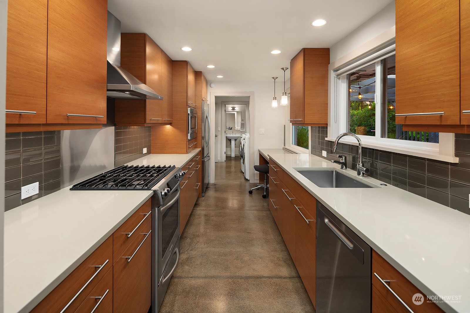 3001 Hunts Point Road Hunts Point, WA 98004 - Photo 12 of 33 a bathroom with a sink a counter top space a large window and stainless steel appliances