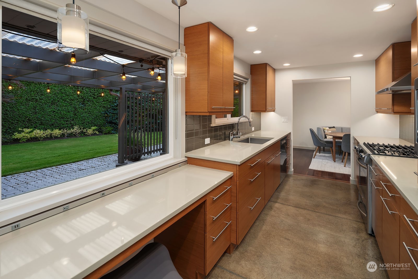 3001 Hunts Point Road Hunts Point, WA 98004 - Photo 14 of 33 a kitchen with kitchen island granite countertop a sink and a stove