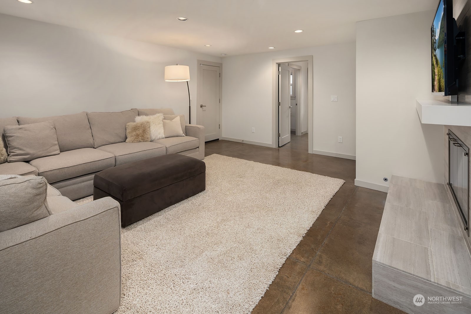 3001 Hunts Point Road Hunts Point, WA 98004 - Photo 19 of 33 a living room with couches and a flat screen tv