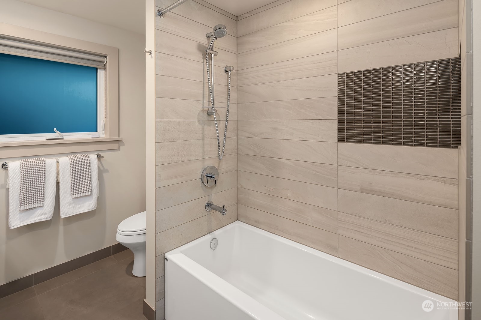 3001 Hunts Point Road Hunts Point, WA 98004 - Photo 23 of 33 a bathroom with a bathtub and toilet