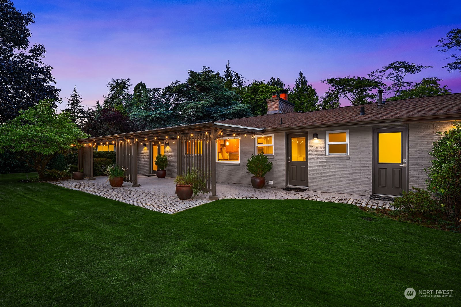 3001 Hunts Point Road Hunts Point, WA 98004 - Photo 25 of 33 a view of a house with a yard and a garden
