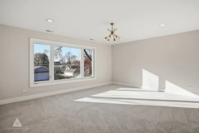 a bedroom with a large bed and a couch