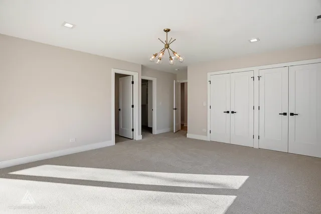 a bathroom with a double vanity sink toilet and shower