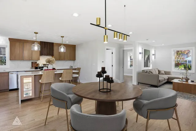 a kitchen with a table chairs sink and cabinets