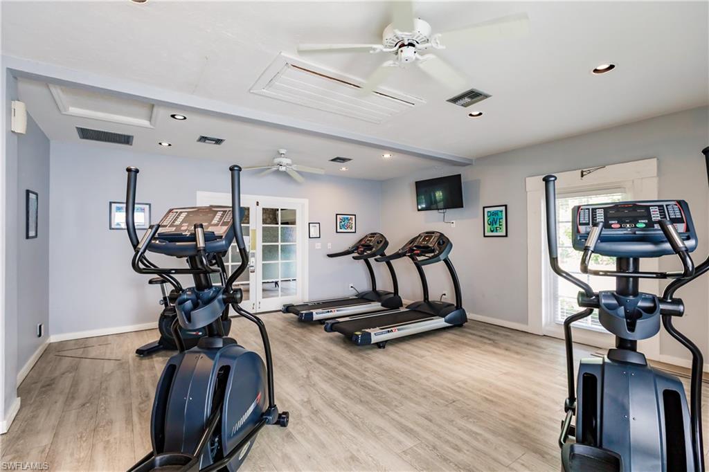 600 Neapolitan Way, Unit 454 Naples, FL 34103 - Photo 20 of 26 a view of a room with gym equipment