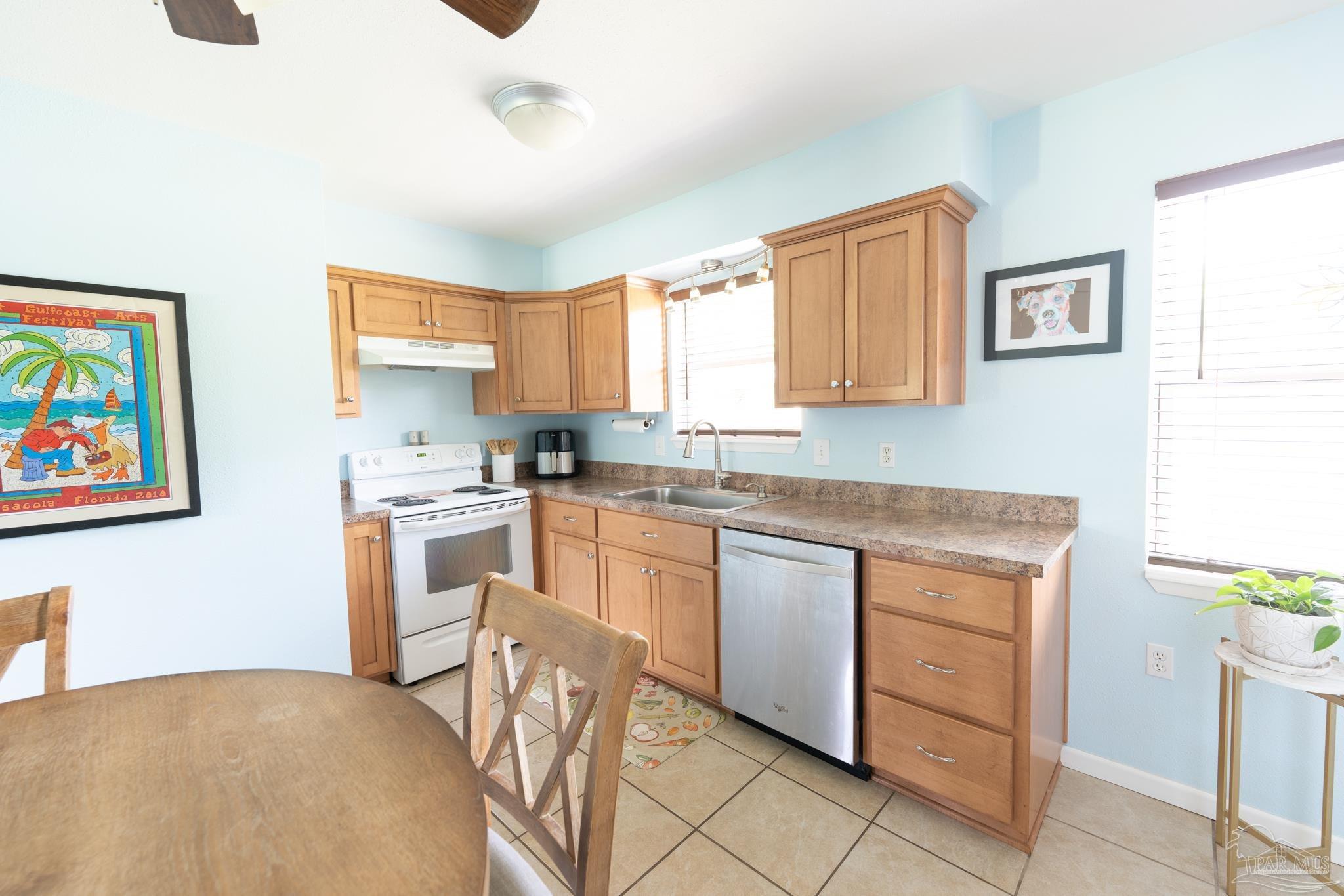1420 Starlight Drive Cantonment, FL 32533 - Photo 5 of 30 a kitchen with cabinets and window