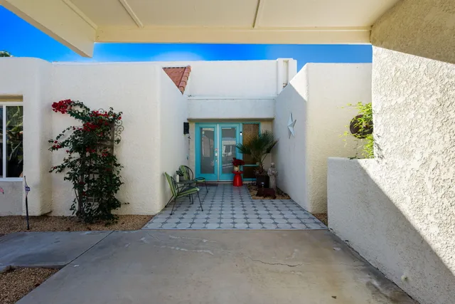 a view of entryway with flower pots