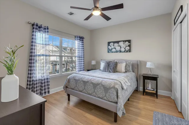 a spacious bedroom with a bed and a table