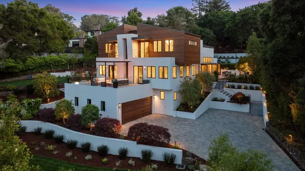 a front view of a house with a yard