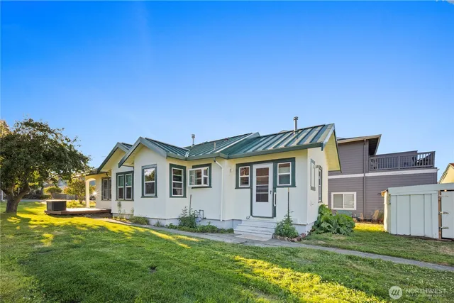 a front view of a house with a yard