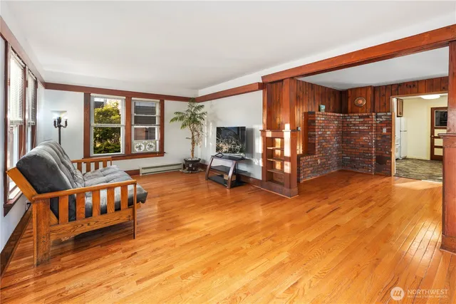 a living room with furniture and large windows