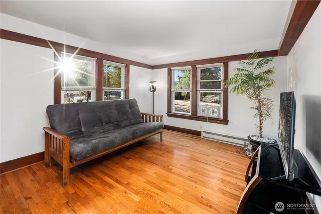 a living room with furniture and a large window