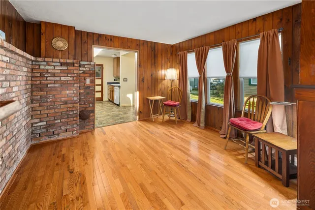 a bedroom with a bed and large window
