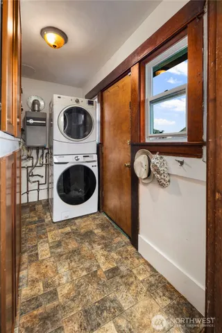 a view of a storage & utility room with a window