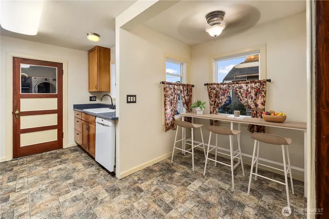a kitchen with furniture and a stove