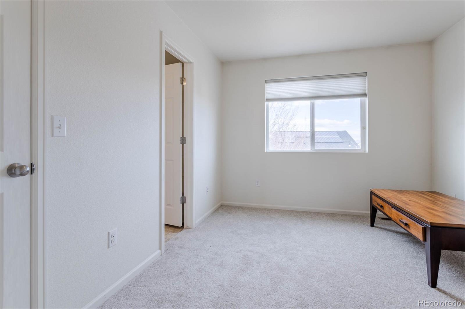 5559 Malta Street Denver, CO 80249 - Photo 17 of 27 an empty room with windows