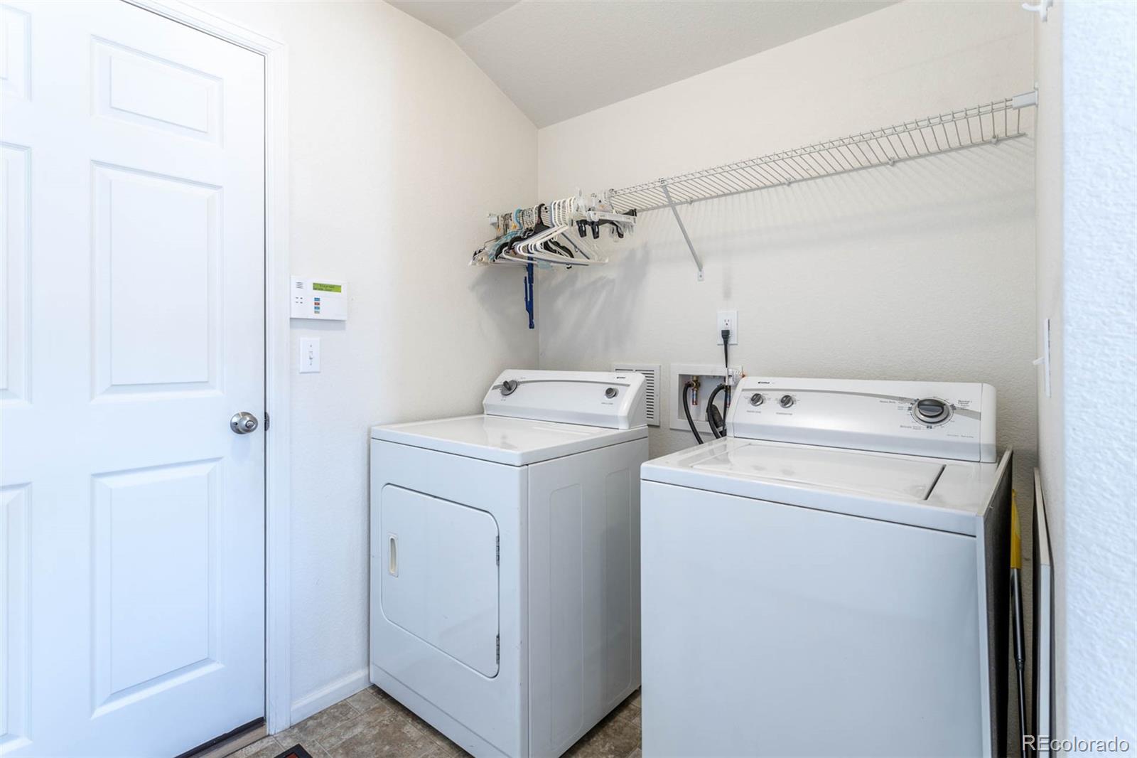 5559 Malta Street Denver, CO 80249 - Photo 19 of 27 a utility room with dryer and washer