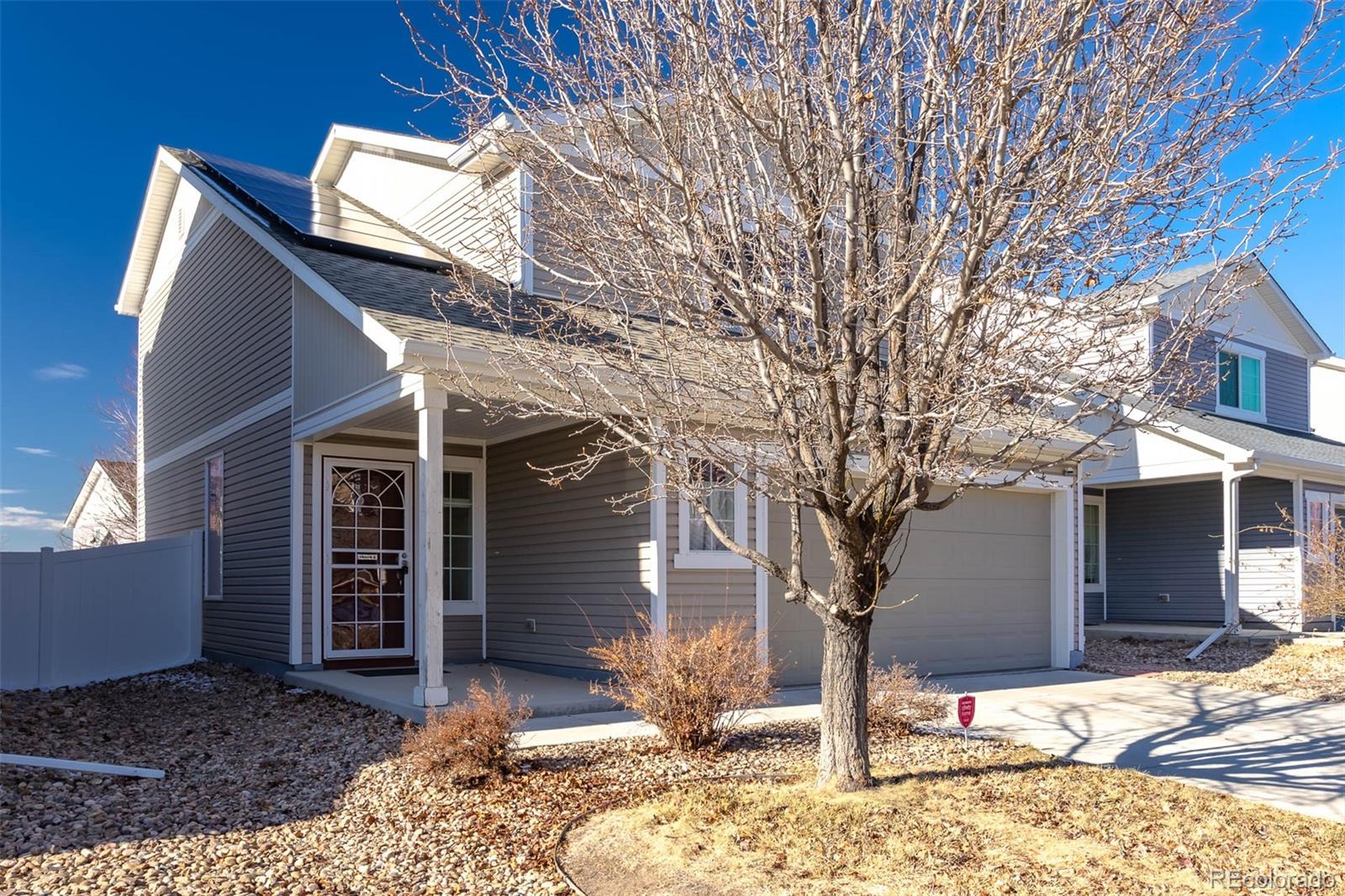 5559 Malta Street Denver, CO 80249 - Photo 2 of 27 a front view of a house
