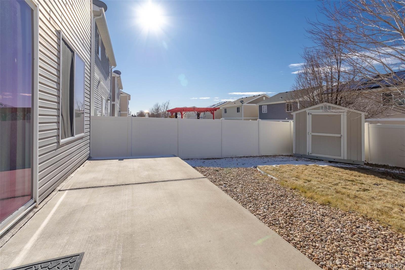 5559 Malta Street Denver, CO 80249 - Photo 21 of 27 a view of a backyard of the house