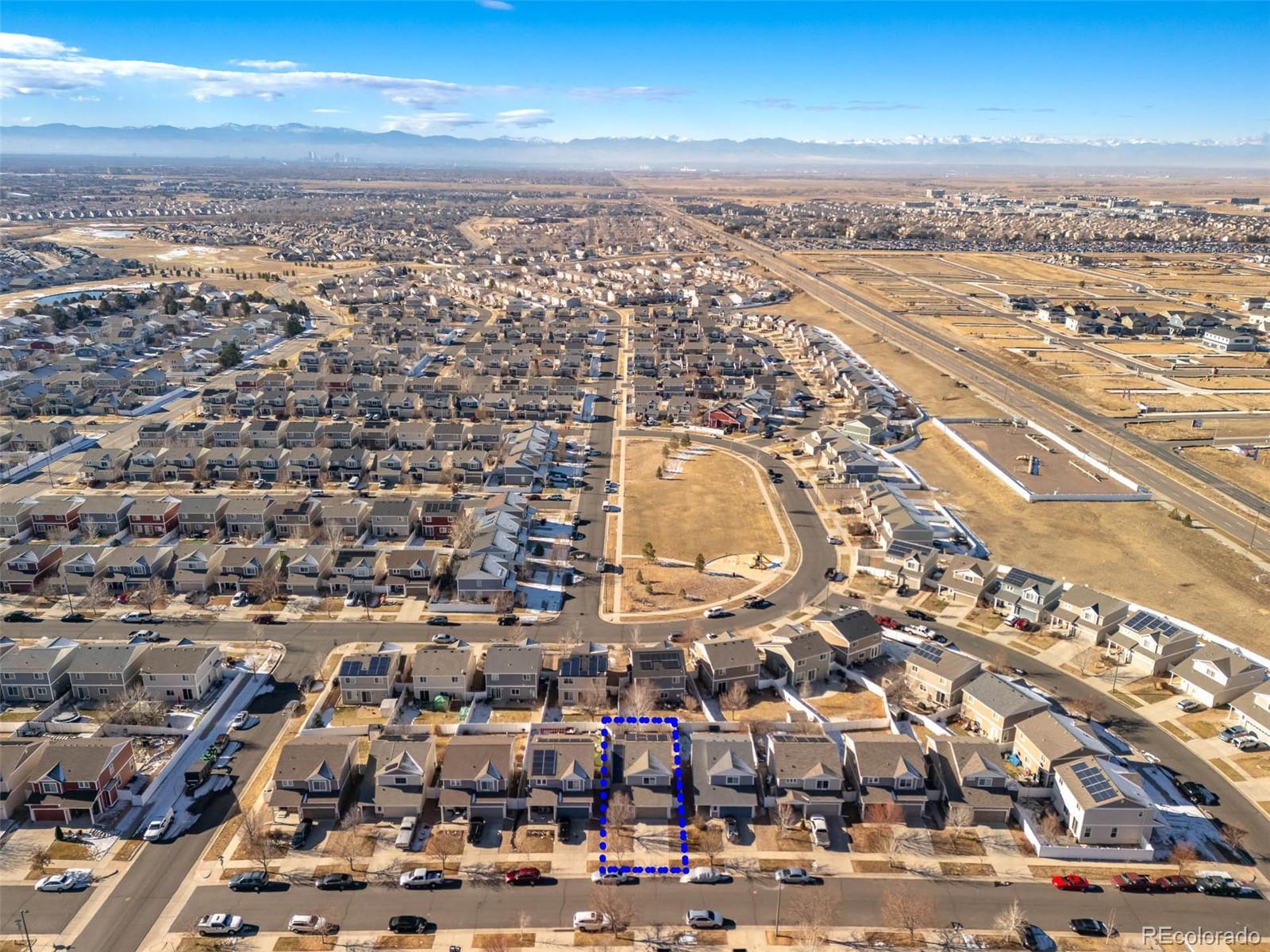 5559 Malta Street Denver, CO 80249 - Photo 24 of 27 an aerial view of residential building with parking space