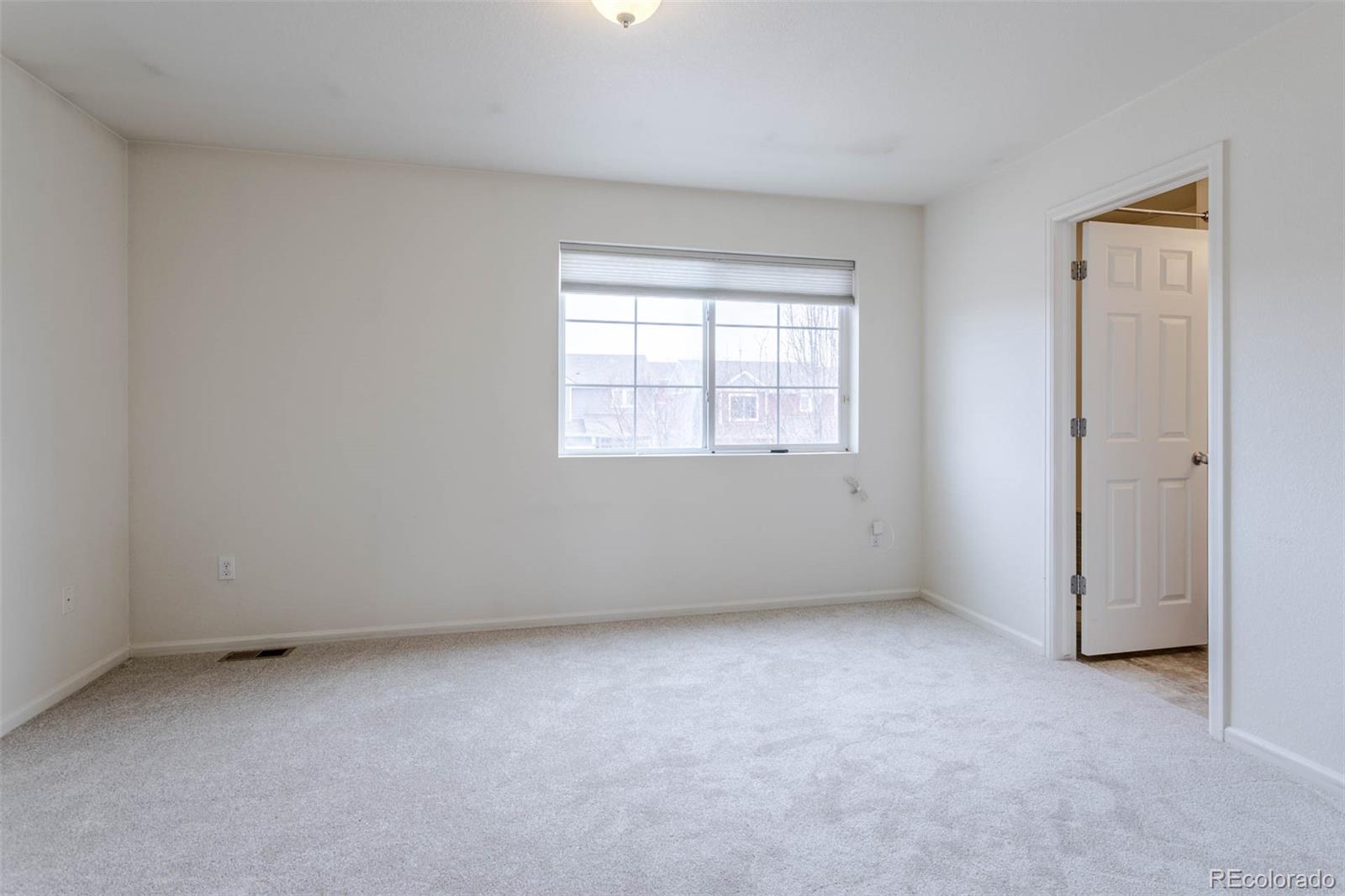 5559 Malta Street Denver, CO 80249 - Photo 10 of 27 an empty room with a window