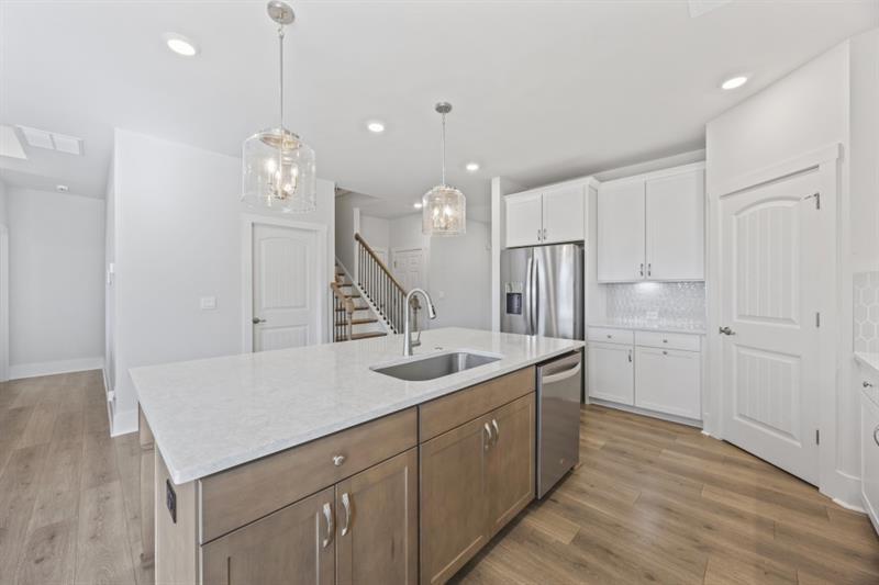 3431 Big View Road Gainesville, GA 30506 - Photo 13 of 59 a kitchen with stainless steel appliances granite countertop a sink a stove and a refrigerator