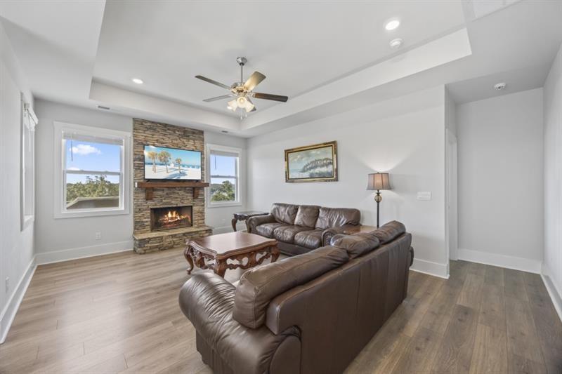 3431 Big View Road Gainesville, GA 30506 - Photo 16 of 59 a living room with furniture a fireplace and a window