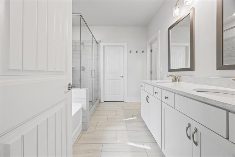 3431 Big View Road Gainesville, GA 30506 - Photo 19 of 59 a spacious bathroom with a double vanity sink and a mirror