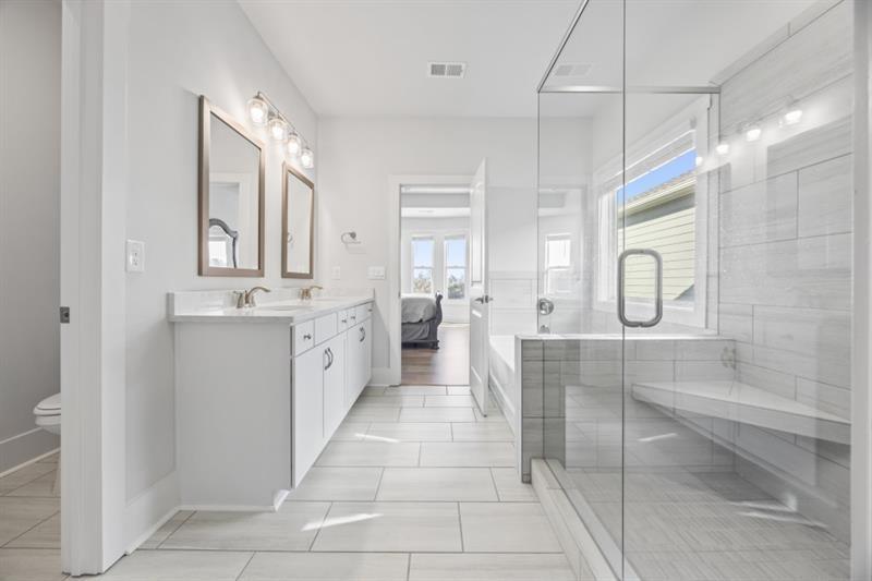 3431 Big View Road Gainesville, GA 30506 - Photo 20 of 59 a large white kitchen with a sink a window and stainless steel appliances