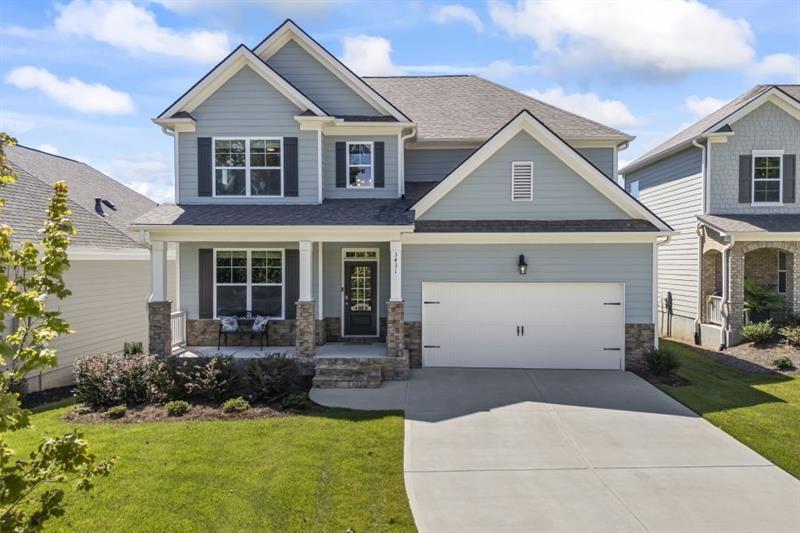 3431 Big View Road Gainesville, GA 30506 - Photo 2 of 59 a front view of a house with a yard and garage