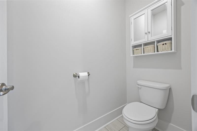 3431 Big View Road Gainesville, GA 30506 - Photo 22 of 59 a white toilet sitting next to a bathroom sink