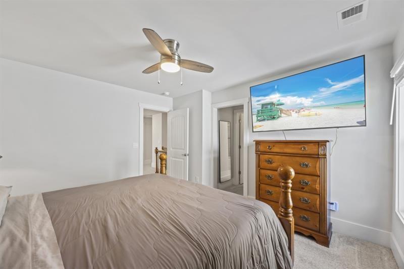 3431 Big View Road Gainesville, GA 30506 - Photo 35 of 59 a bedroom with a bed and a chandelier