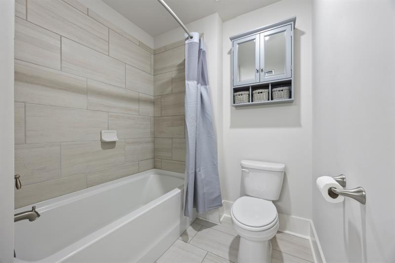 3431 Big View Road Gainesville, GA 30506 - Photo 36 of 59 a bathroom with a toilet and a shower