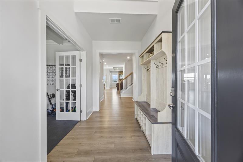 3431 Big View Road Gainesville, GA 30506 - Photo 9 of 59 a view of a hallway with wooden floor and staircase