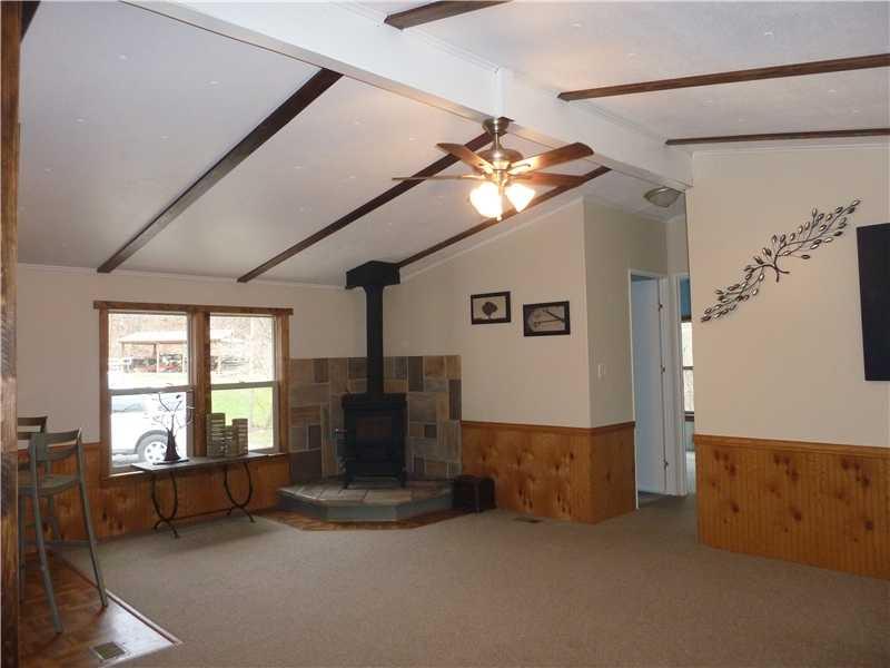 836 State Rt 30 Clinton, PA 15026 - Photo 4 of 21 Living Room. You can see how meticulously this home has been cared for and updated! Propane heat costs are VERY low due to the warmth of the wood burner. Lots of wood stocked up outside for the winter days ahead! Open floor plan....lots of natural light!